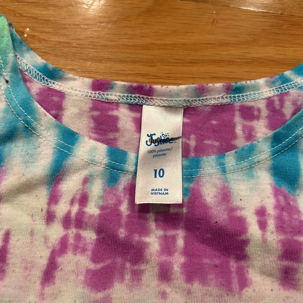 Justice size 10 girl tank top- pulling due to wash